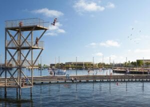 Barn som hoppa från hopptornet vid den nya strandpromenaden tillhörande Lövekulle Stationsstad