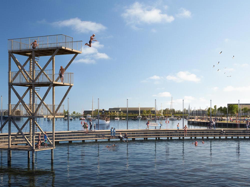 Barn som hoppa från hopptornet vid den nya strandpromenaden tillhörande Lövekulle Stationsstad